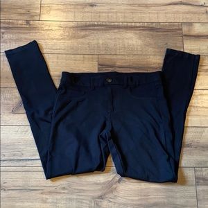 Woman’s black pants.